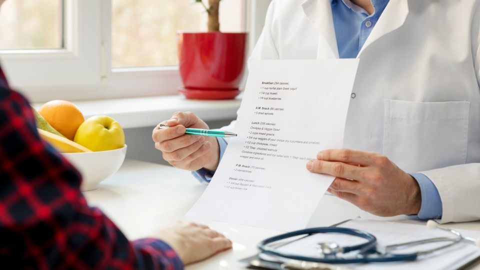 Healthcare professional presenting information to the patient.