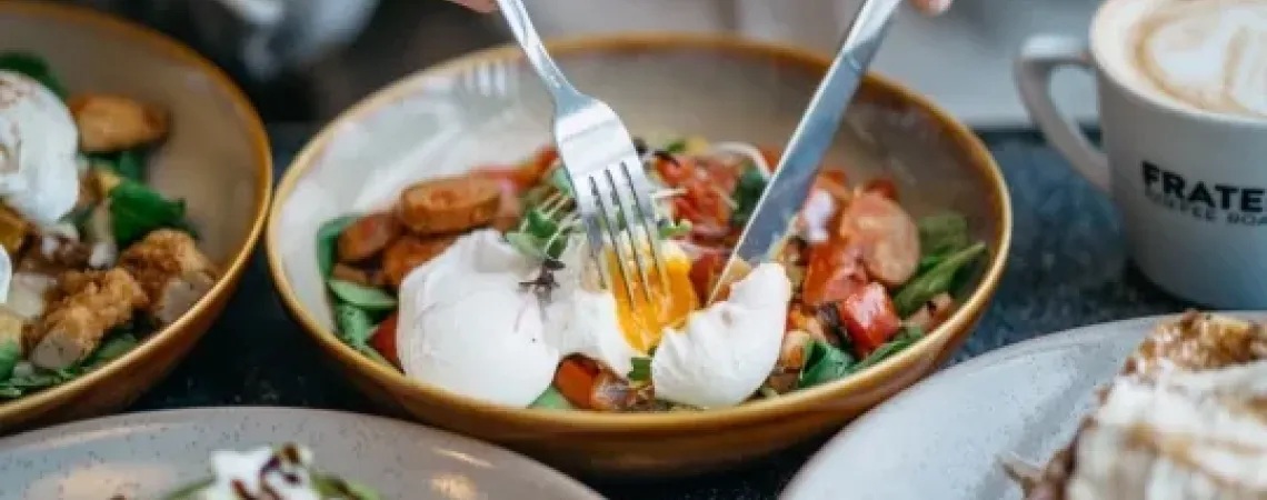 eggs, sausages and vegetables in a bowl