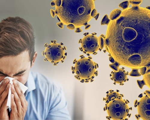 homme qui se mouche à côté du coronavirus