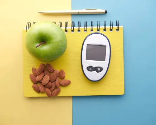 Glucomètre pomme amandes et carnet de notes
