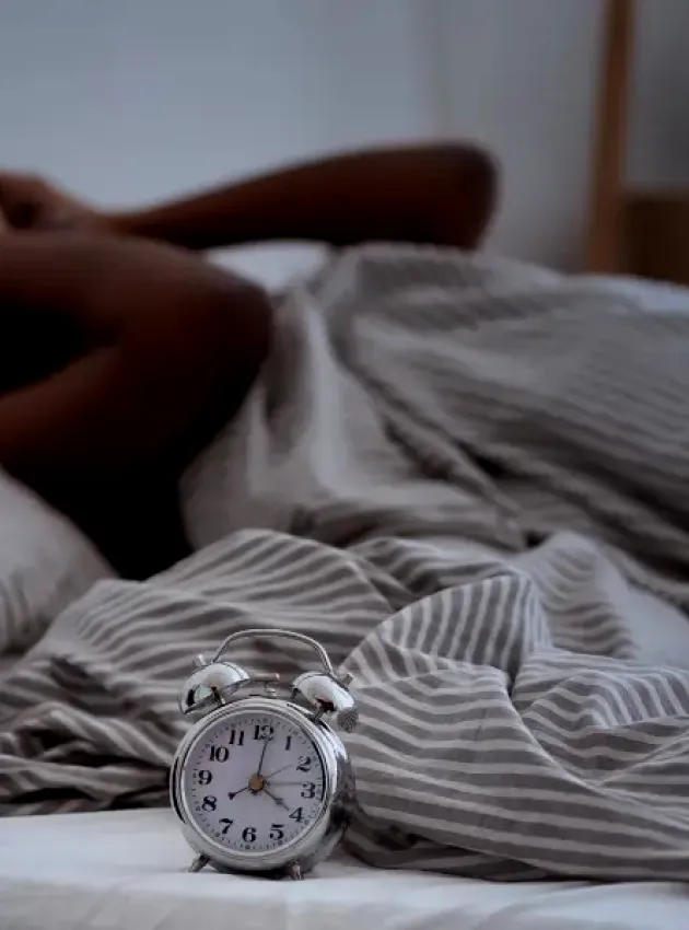 Personne qui essaye de s'endormir - Comment la nutrition peut améliorer votre sommeil