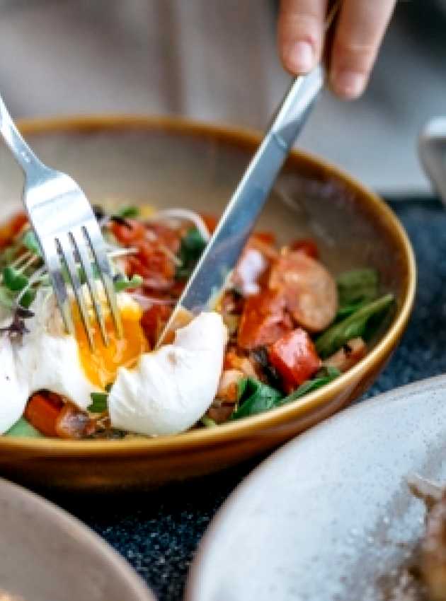 eggs, sausages and vegetables in a bowl